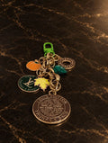 Autumn bag charm with chunky gold-tone vintage links, a green clasp, pumpkin and leaf details, and upcycled LV medallions