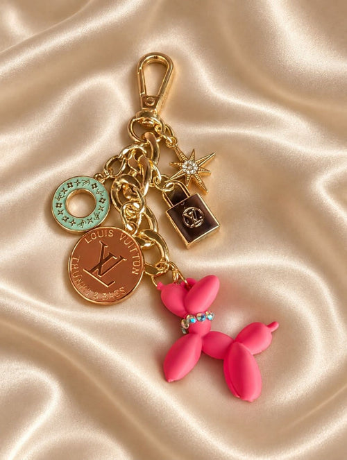 Bougie Bark bag charm with a hot pink balloon dog wearing rhinestones, gold-tone links, upcycled LV charms, a mint accent and a sparkling star