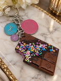 Cosmic Chrome chocolate-bar bag charm with colorful decorative sprinkles, silver-tone hardware and three upcycled LV charms