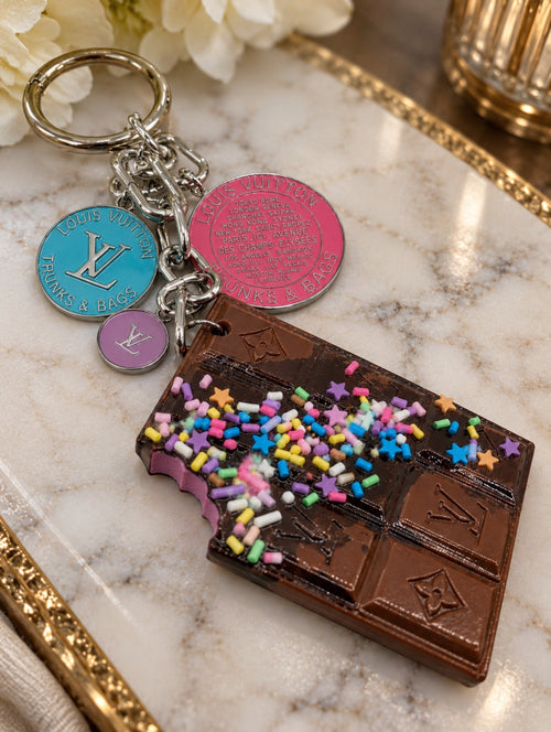 Cosmic Chrome chocolate-bar bag charm with colorful decorative sprinkles, silver-tone hardware and three upcycled LV charms