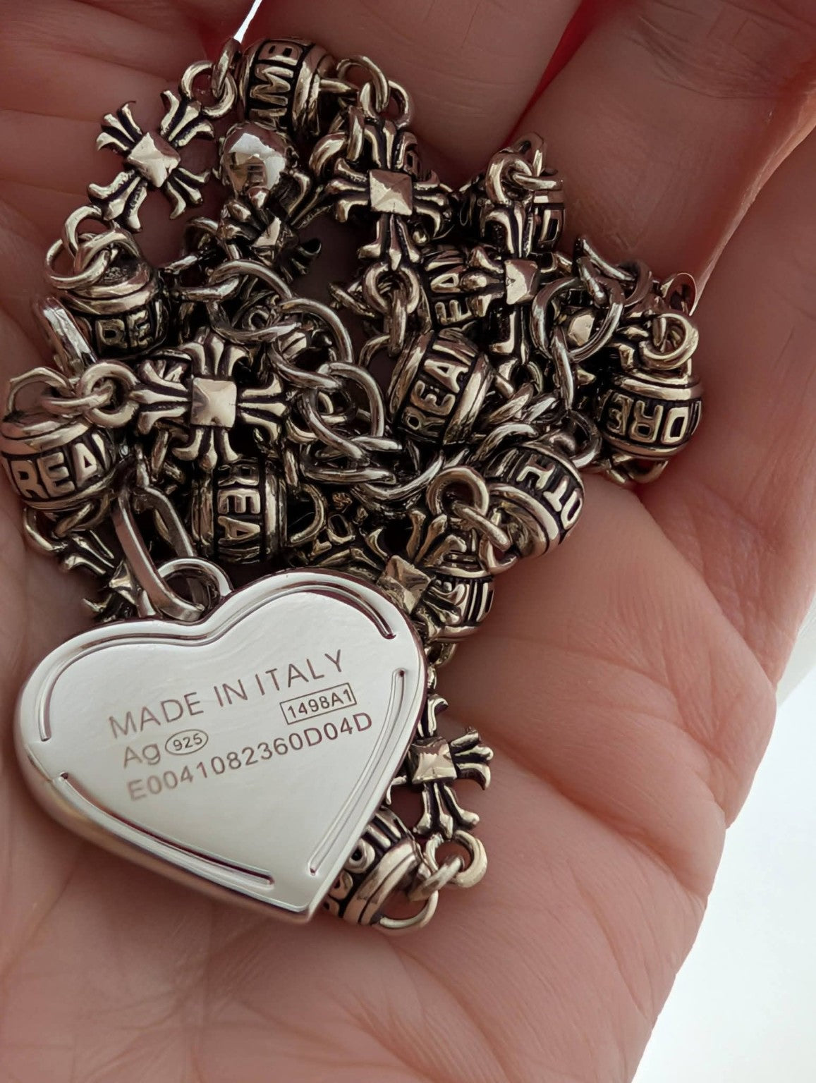 Reverse of the heart charm showing its markings